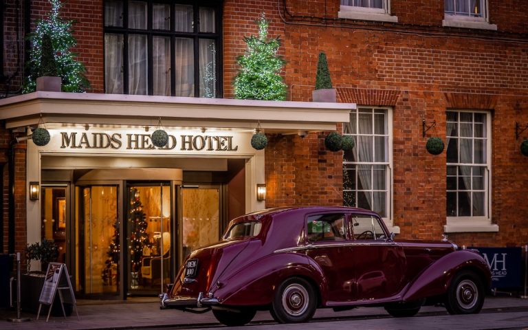 Maids Head Bentley at front of Hotel at Christmas 768x480